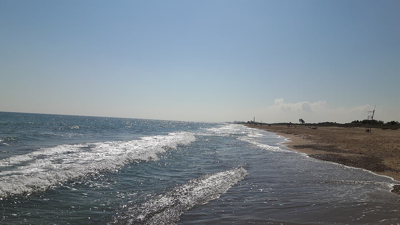 Wide sandy Pinedo Beach south of Valencia with the Mediterranean Sea