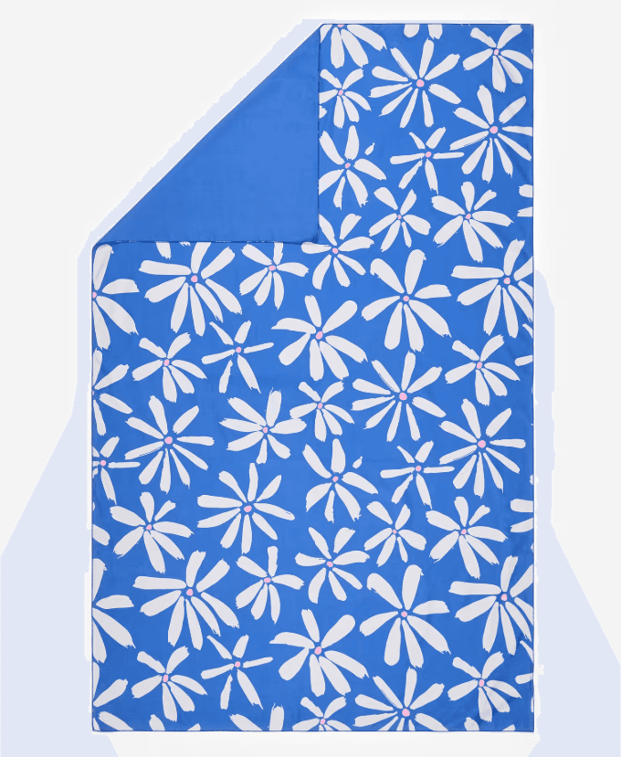 Blue Decathlon XL Game microfibre towel with white floral print and pink flower centres